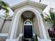 Home exterior featuring an arched entryway at 9625 Fox Hearst Rd, Tampa, FL 33647