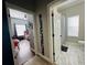 Hallway view of bedroom and bathroom with tile flooring at 9625 Fox Hearst Rd, Tampa, FL 33647
