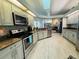 Modern kitchen featuring stainless steel appliances and granite countertops at 9625 Fox Hearst Rd, Tampa, FL 33647