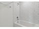 Bathroom with white subway tile and bathtub at 9804 Crescent Moon Dr, Riverview, FL 33578