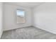 Simple bedroom with grey carpet and one window at 9804 Crescent Moon Dr, Riverview, FL 33578