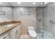 Bathroom features granite countertop and walk-in shower at 1111 N Bayshore Blvd # B7, Clearwater, FL 33759