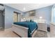 Light blue bedroom with white furniture and teal bedding at 1111 N Bayshore Blvd # B7, Clearwater, FL 33759