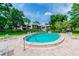 Community pool with surrounding lounge chairs at 1111 N Bayshore Blvd # B7, Clearwater, FL 33759