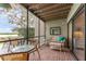 Relaxing screened porch with wicker furniture, overlooking the water at 1111 N Bayshore Blvd # B7, Clearwater, FL 33759