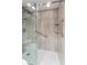 Walk-in shower with glass enclosure and built-in shelving at 1111 N Bayshore Blvd # B7, Clearwater, FL 33759