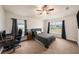 Spacious bedroom with large window and ceiling fan at 11521 Sunder Berry St, Hudson, FL 34667