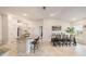 Modern kitchen featuring granite island, breakfast bar, and dining area at 11521 Sunder Berry St, Hudson, FL 34667