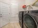 Laundry room with washer, dryer, and shelving at 11521 Sunder Berry St, Hudson, FL 34667