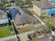 Aerial view showcasing the backyard, featuring a patio, and a fenced yard at 11536 Tangle Stone Dr, Gibsonton, FL 33534