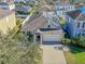 Aerial view of a single-Gathering home with solar panels and a fenced backyard at 11536 Tangle Stone Dr, Gibsonton, FL 33534