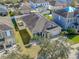 Aerial view of a house showing the front yard, driveway and neighborhood at 11536 Tangle Stone Dr, Gibsonton, FL 33534