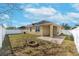 Backyard with patio, fire pit, and grassy area at 11536 Tangle Stone Dr, Gibsonton, FL 33534