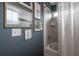 Bathroom with a shower/tub combo and gallery wall at 117 W Minnehaha St, Tampa, FL 33604