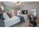 Spacious bedroom with large bed, TV, and home office area at 117 W Minnehaha St, Tampa, FL 33604