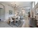 Farmhouse style dining room with a wooden table and chandelier at 117 W Minnehaha St, Tampa, FL 33604