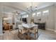 Farmhouse style dining room with a wooden table and chandelier at 117 W Minnehaha St, Tampa, FL 33604