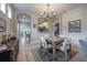 Farmhouse style dining room with a wooden table and chandelier at 117 W Minnehaha St, Tampa, FL 33604