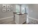 Kitchen island with wood top and white cabinets at 117 W Minnehaha St, Tampa, FL 33604