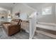 Carpeted stairs with brown leather couch and wooden table at 117 W Minnehaha St, Tampa, FL 33604