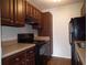 Kitchen area with dark wood cabinets and appliances at 11901 4Th N St # 10105, St Petersburg, FL 33716