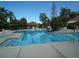 Community pool with lounge chairs at 11901 4Th N St # 10105, St Petersburg, FL 33716