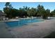 Community pool with volleyball net and brick patio; perfect for relaxation and recreation at 11901 4Th N St # 10105, St Petersburg, FL 33716