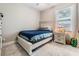 Bright bedroom with a full-size bed and neutral decor at 1210 E Mohawk Ave, Tampa, FL 33604