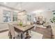 Elegant dining room with a farmhouse table and modern lighting at 1210 E Mohawk Ave, Tampa, FL 33604