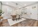 Bright dining area with hardwood floors and a farmhouse table at 1210 E Mohawk Ave, Tampa, FL 33604