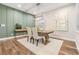 Modern farmhouse dining room with green accent wall at 1210 E Mohawk Ave, Tampa, FL 33604