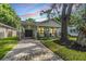 Quaint craftsman style home with a brick walkway and covered porch at 1210 E Mohawk Ave, Tampa, FL 33604