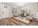 Light and airy living room with hardwood floors and stylish decor at 1210 E Mohawk Ave, Tampa, FL 33604