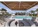 Relaxing pool area with shaded seating and lounge chairs at 12408 52Nd E St, Parrish, FL 34219