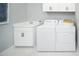 Convenient laundry room with washer, dryer, and utility sink at 12411 52Nd E St, Parrish, FL 34219