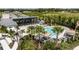 Aerial view of community pool, cabana, and surrounding landscape at 12436 52Nd E St, Parrish, FL 34219