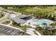 Aerial view showing community pool, cabana, parking and landscaping at 12436 52Nd E St, Parrish, FL 34219