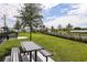 Fenced dog park with grassy area and picnic table at 12436 52Nd E St, Parrish, FL 34219