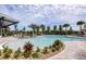 Resort-style pool with lounge chairs and a covered seating area at 12436 52Nd E St, Parrish, FL 34219