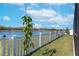 Spacious backyard with a white fence and lake view at 12712 Mangrove Forest Dr, Riverview, FL 33579