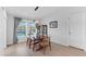 Bright dining room with wood table and pool view at 12712 Mangrove Forest Dr, Riverview, FL 33579