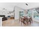 Dining room with wood table and access to the pool area at 12712 Mangrove Forest Dr, Riverview, FL 33579