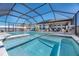 Inviting pool and spa with covered patio at 12712 Mangrove Forest Dr, Riverview, FL 33579