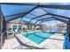 Enjoy this screened pool and spa with a large patio at 12712 Mangrove Forest Dr, Riverview, FL 33579