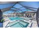 Relaxing pool and spa with covered patio and grill at 12712 Mangrove Forest Dr, Riverview, FL 33579