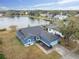 Aerial view of a blue house near a lake at 1330 Monte Lake Dr, Valrico, FL 33596