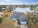 House with lake view, gray roof, and blue exterior at 1330 Monte Lake Dr, Valrico, FL 33596