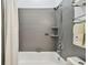 Bathroom with shower/tub combo and gray tile at 1330 Monte Lake Dr, Valrico, FL 33596