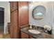 Bathroom with dark wood cabinets and granite countertop at 1330 Monte Lake Dr, Valrico, FL 33596