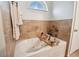 Relaxing bathroom with a soaking tub and tile surround at 1330 Monte Lake Dr, Valrico, FL 33596